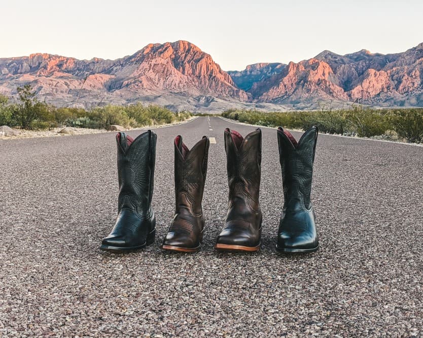 2 pairs of Chisos boots on the road