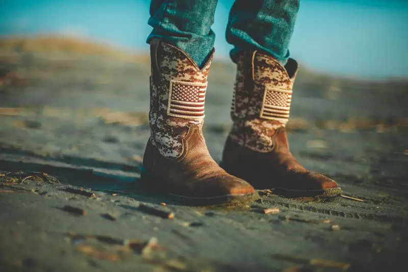 A man wears stockman boots