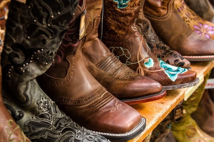 Many square to cowboy boots on display