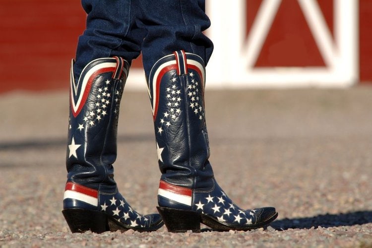 Women wear cowboy boots with flag patterns
