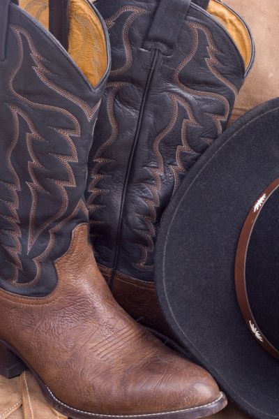 A pair of cowboy boots and a cowboy hat