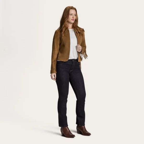 A women wears jeans with t shirt and suede frige leather coat from Tecovas
