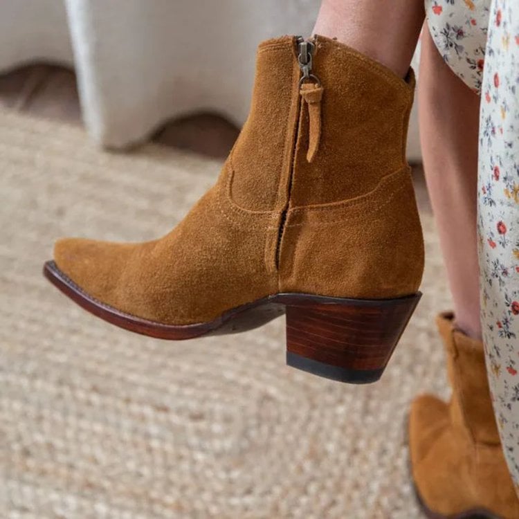 Girl wear The Daisy suede boots from Tecovas