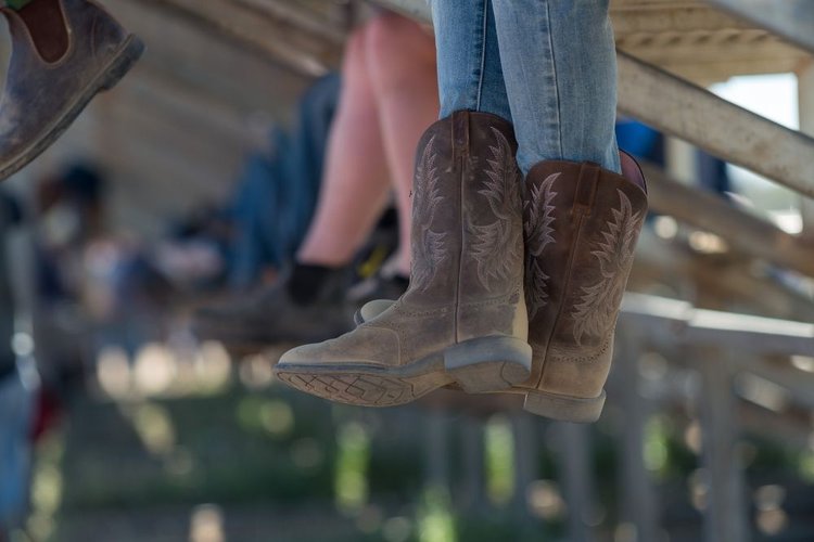women wear loose cowboy boots and sit
