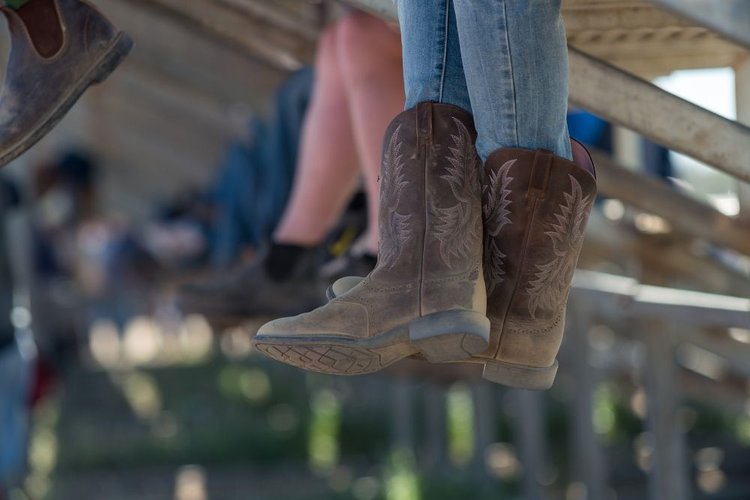 women wear loose cowboy boots and sit