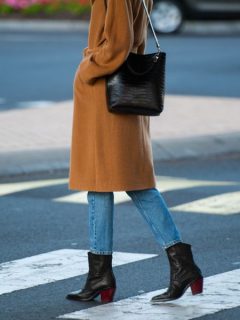 A woman are walking in cowboy boots