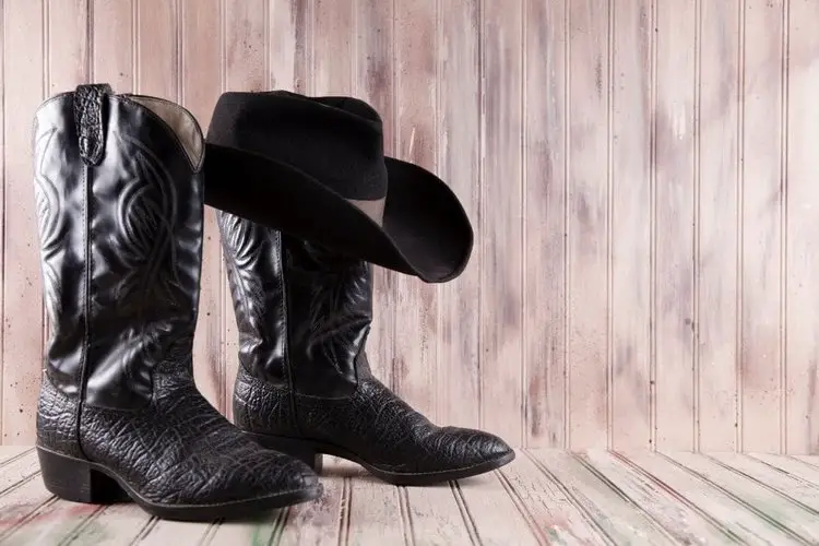 black cowboy boots and hat