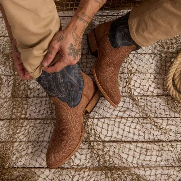 A man wears The Quintin cowboy boots