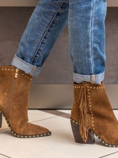 Women wear ankle cowboy boots with jeans