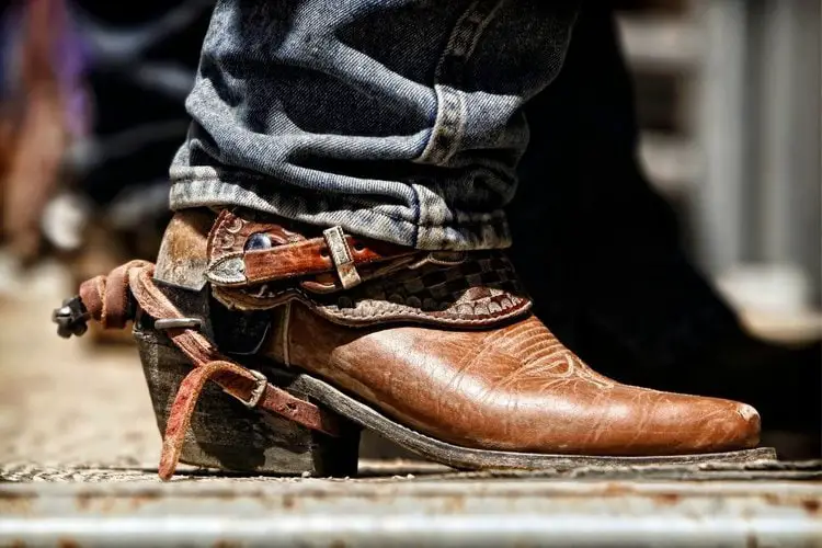 men wear cowboy boots with spur are standing