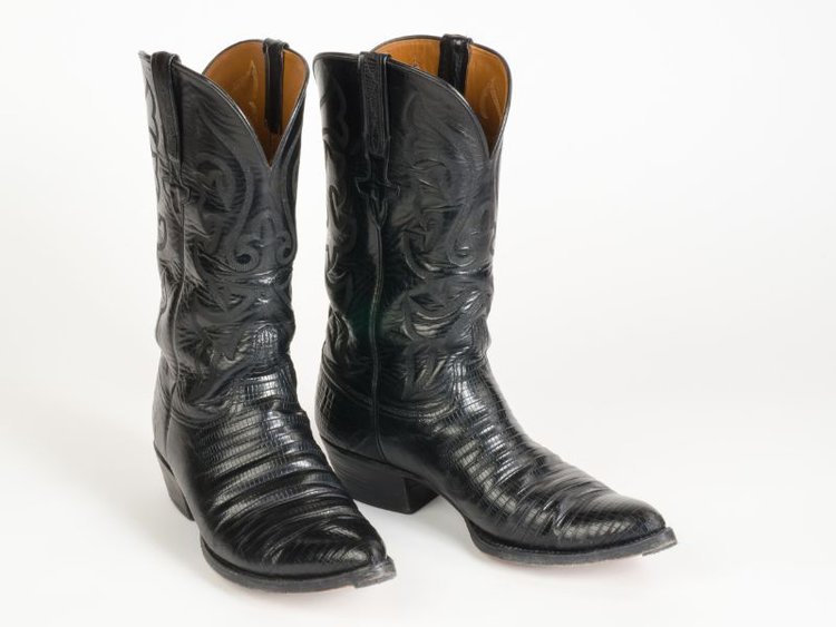 A pair of black lizard boots