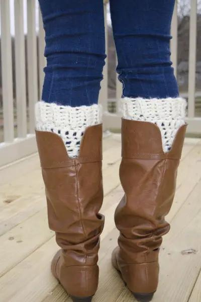 A woman wears boot cuffs with cowboy boots 