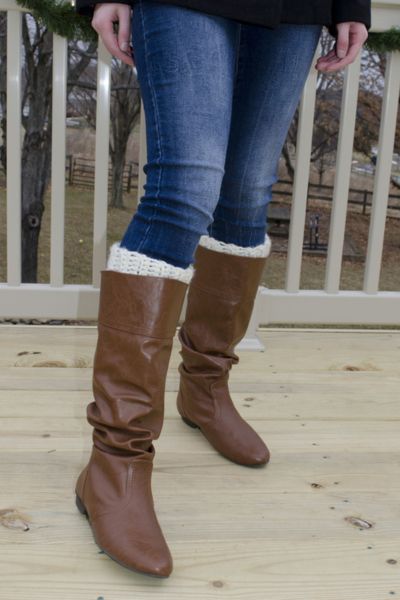 A woman wears boot cuffs with cowboy boots