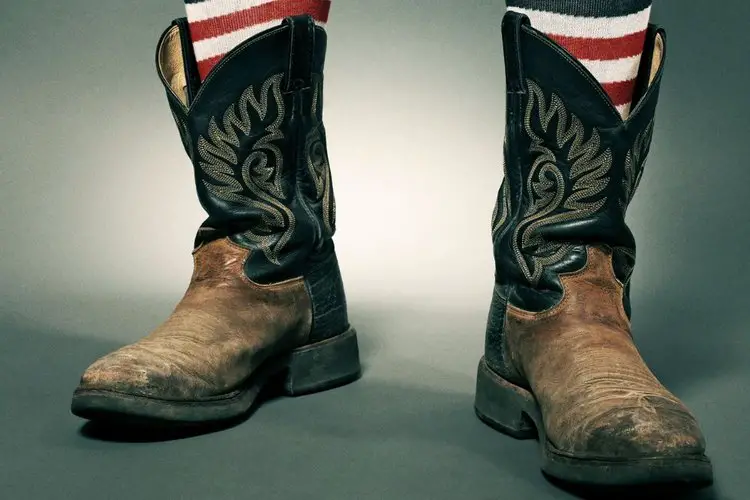 men wear cowboy boots with a pair of american flag socks