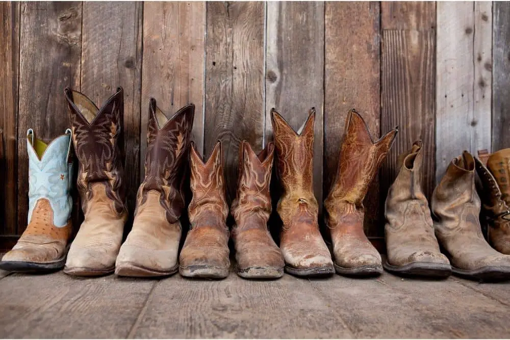 Keep cowboy boots clean The first step is to keep cowboy boots clean, so they will stay in good quality state over the long term. Cowboy boots that have been in a dirty or moldy condition for too long can cause them to crack. To clean leather cowboy boots, you need a horsehair brush with a leather cleaner , some warm water and a dry rag. Spray a thin layer of warm water on the leather surface, use a horsehair brush to pre-clean the cowboy boots (rub directly on the surface) Apply the leather cleaner on horsehair brush or surface leather cowboy boots Scrub the cowboy boot surface thoroughly with a horsehair brush, pay close attention to seams and welt areas. Use a dry rag to wipe residue and excess of leather cleaner. It’s done! Cleaning suede cowboy boots requires a suede brush, eraser , little warm water and suede cleaner . First, use the suede brush to clean suede cowboy boots (you can coat a thin layer of warm water). Scrub the suede surface of suede for precleaning. Use an eraser to continue cleaning cowboy boots. The eraser works to remove colored stains (stains from mud, soil) on suede boots. Apply suede cleaner to the surface of suede cowboy boots, then continue to use suede brush and eraser to scrub that surface, pay attention to scrub thoroughly at stitching and welt. Rub until you’ve seen suede cowboy boots are completely clean. And that’s it!