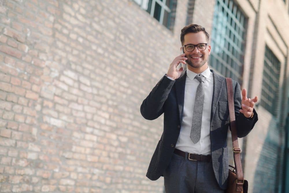 a man wearing suit and cowboy boots for business casual look