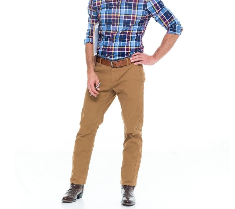 man wearing a checkered dress shirt, khakis pants with cowboy boots for a formal look