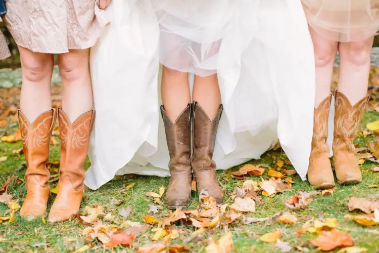 A woman wears cowboy boots in her wedding