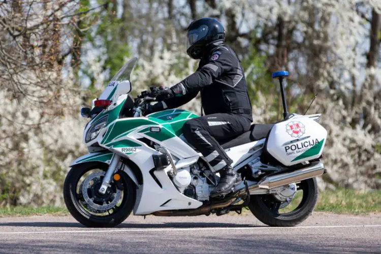 A man wears Touring motorcycle boots