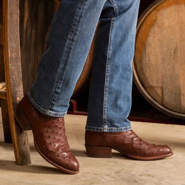 man wears jeans and The Wyatt cowboy boots from Tecovas