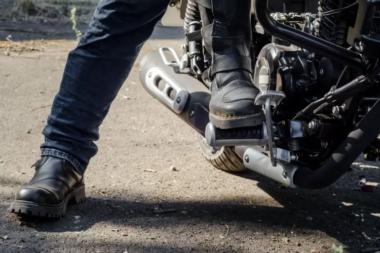 two people wearing motorcycle boots