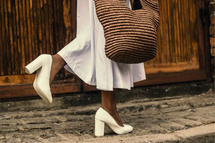 woman wears high heeled pumps