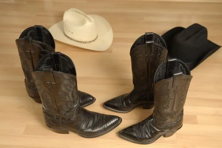 2 pair of cowboy boots an 2 cowboy hats