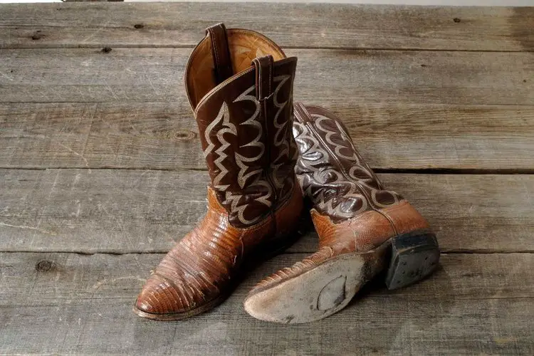 leather sole cowboy boot on the wood base