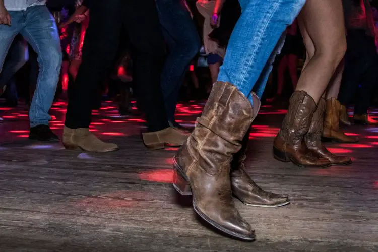 many people do line dancing with cowboy boots
