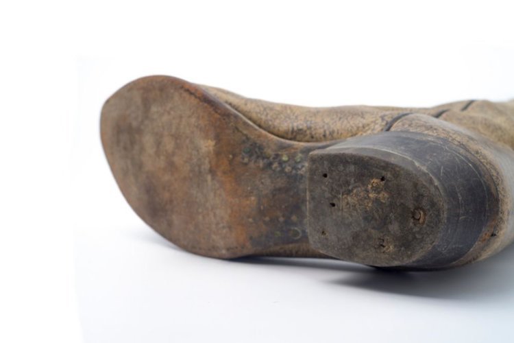 the sole of cowboy boot are worn out