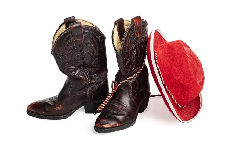 Dark brown cowboy boots with red hat