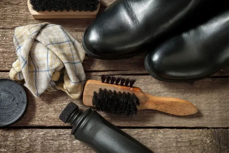 cowboy boots with brush, polish and clean cloth