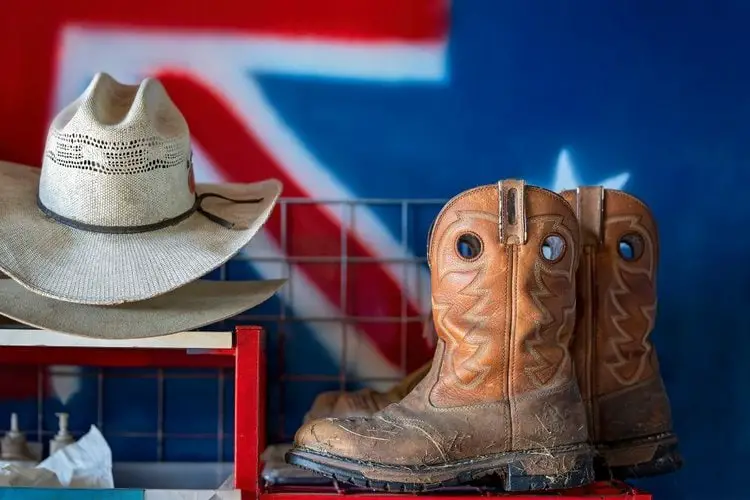 Cowboy boots and cowboy hat in the house