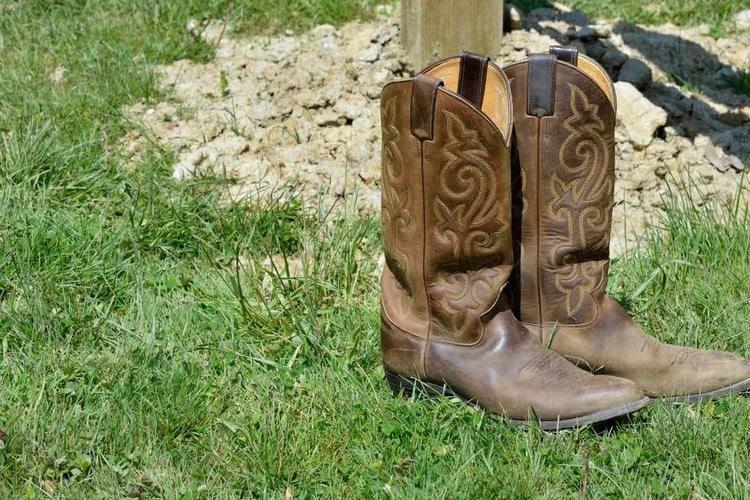 cowboy boots on grass