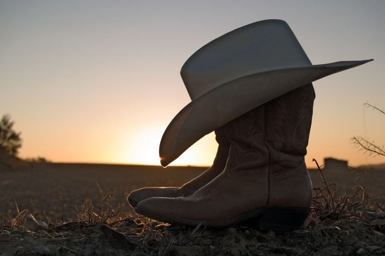 Cowboy boots and cowboy hat in the summer