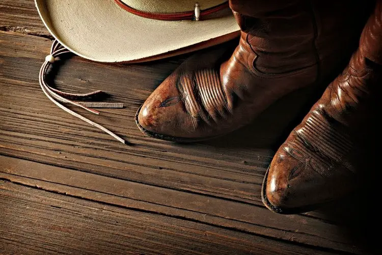 cowboy boots covered with mink oil