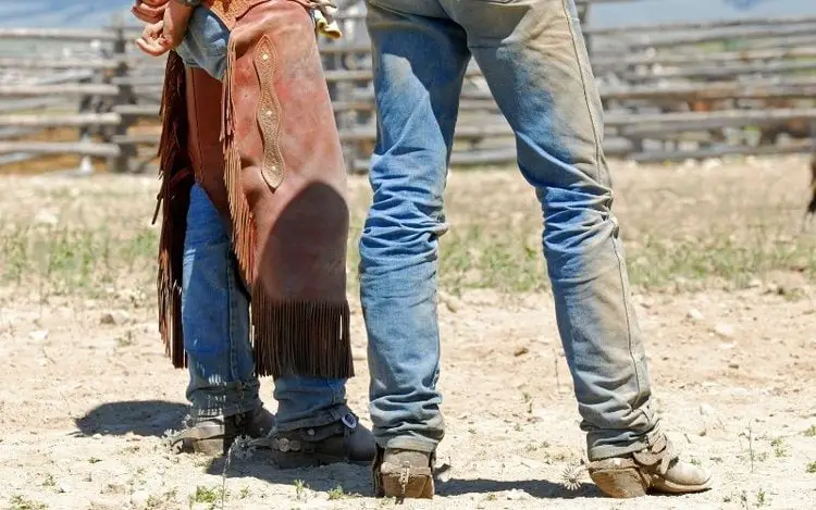 Man wear cowboy boots on ranch