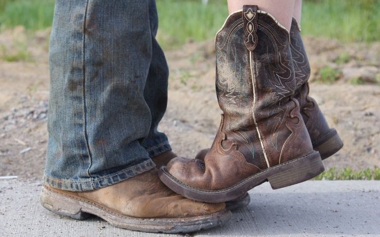 Men and women wear cowboy boots