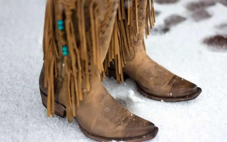 Women cowboy boots in snow