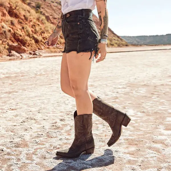 Woman wears shorts and the Sadie cowboy boots