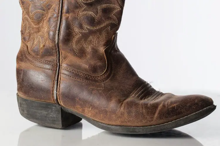 dry rot cowboy boots appear with cracks and fade color