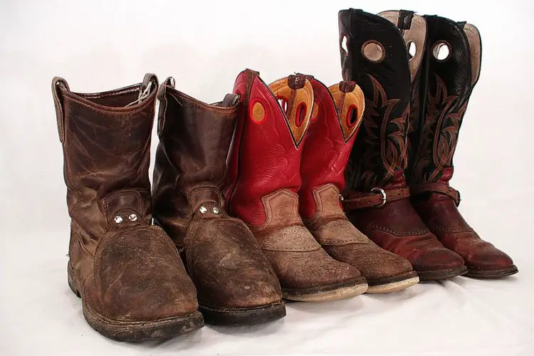 three pairs of dry rot cowboy boots