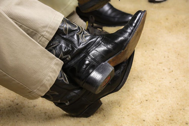 Man wear lizard cowboy boots with dress pants