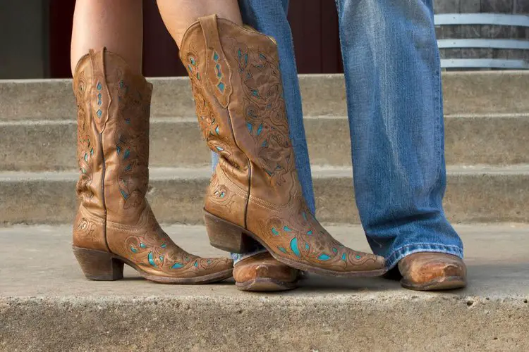 man and woman wearing cowboy boots