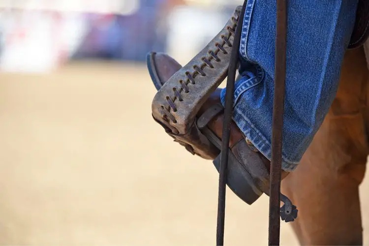 cowboy boot hooked into the stirrup