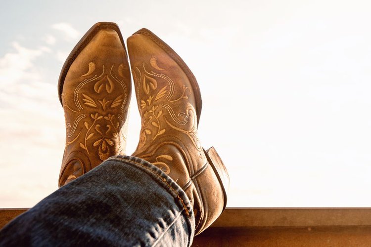 man wears beautiful cowboy boots tapered at the toe