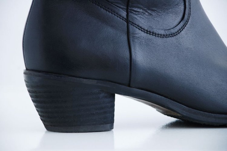 the high heel of black cowboy boot