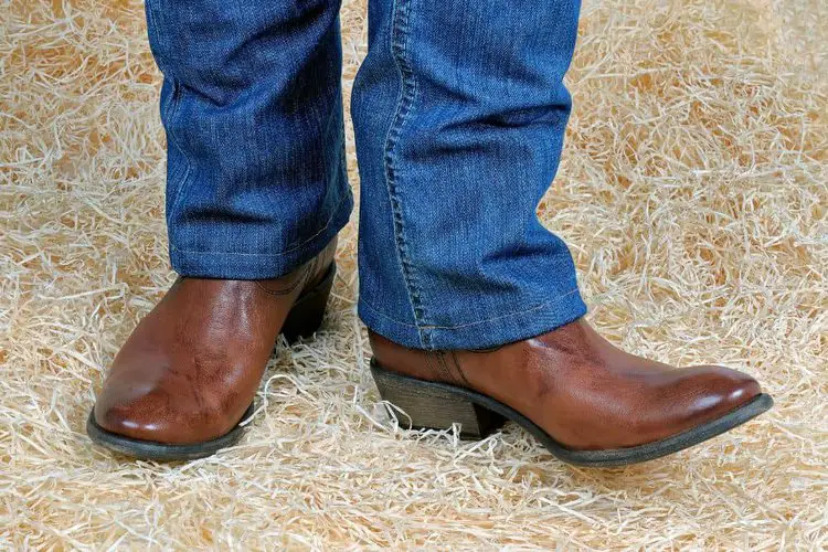 the jeans length covers a part of vamp of cowboy boots