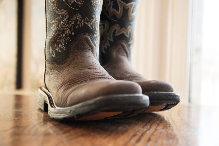 A pair of cowboy boots on the floor