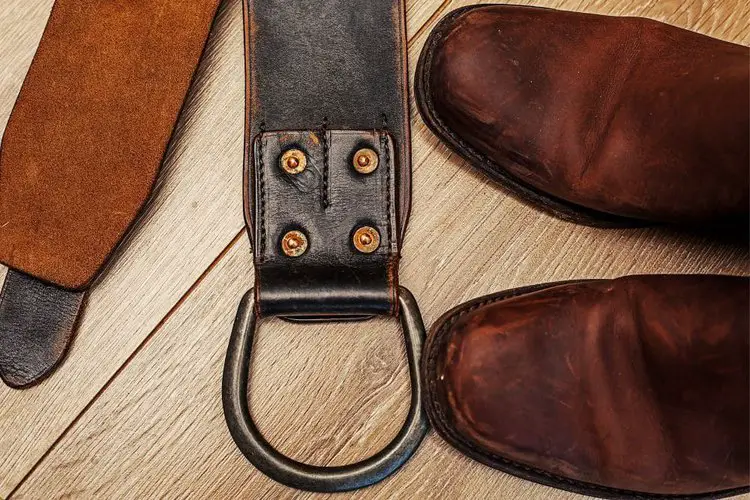 Black belt, brown belt and cowboy boots